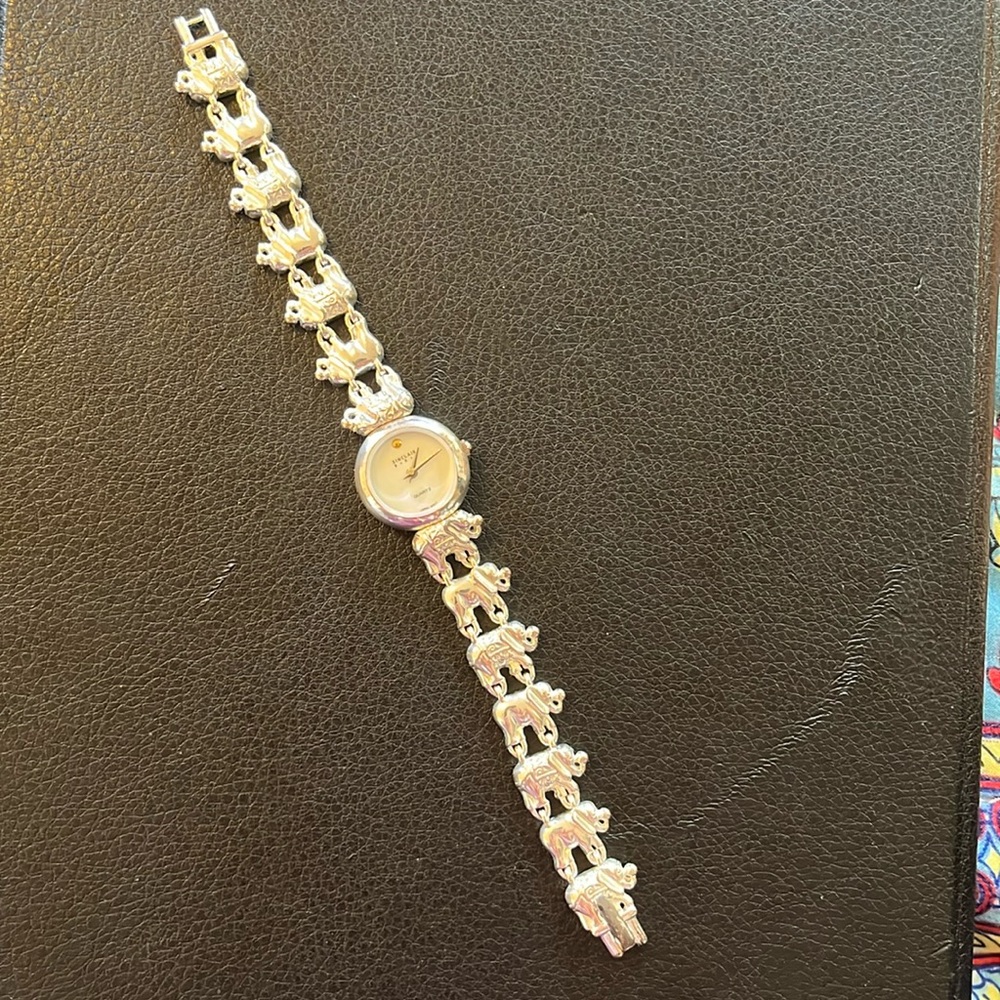 Sterling silver Sinclair women’s watch w/elephant links band.Never worn.